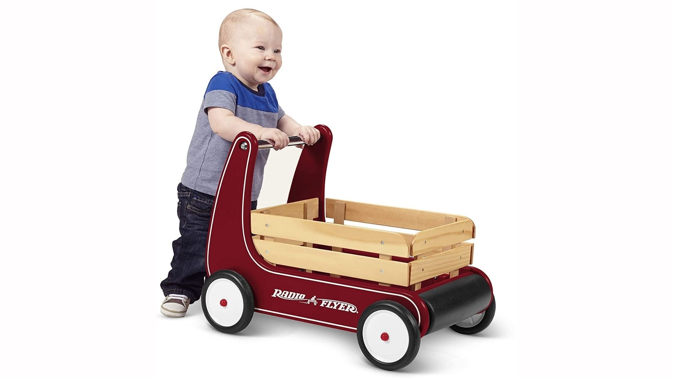 baby pushing a walker wagon